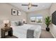 Bedroom with a queen bed, neutral decor, and window view at 8273 Shooting Star Rd, Sarasota, FL 34241