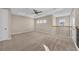 Large bedroom with neutral carpet and ceiling fan at 8273 Shooting Star Rd, Sarasota, FL 34241