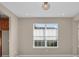 Bright dining room with large window and chandelier at 8273 Shooting Star Rd, Sarasota, FL 34241