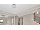 Bright entryway with staircase and view into the kitchen at 8273 Shooting Star Rd, Sarasota, FL 34241