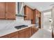 Modern kitchen with stainless steel appliances and wood cabinets at 8273 Shooting Star Rd, Sarasota, FL 34241