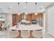 Modern kitchen with large island and seating for three at 8273 Shooting Star Rd, Sarasota, FL 34241