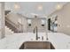 Kitchen island with quartz countertop and dual sinks at 8273 Shooting Star Rd, Sarasota, FL 34241