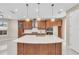 Modern kitchen with island and stainless steel appliances at 8273 Shooting Star Rd, Sarasota, FL 34241