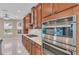 Stainless steel appliances and light wood cabinets in kitchen at 8273 Shooting Star Rd, Sarasota, FL 34241