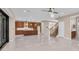 Open concept living room with kitchen and staircase view at 8273 Shooting Star Rd, Sarasota, FL 34241