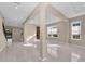 Spacious living room with tile flooring and large windows at 8273 Shooting Star Rd, Sarasota, FL 34241