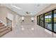 Open living room with pool view and tile flooring at 8273 Shooting Star Rd, Sarasota, FL 34241