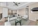 Bright loft features a sitting area with stylish furniture and a ceiling fan at 8273 Shooting Star Rd, Sarasota, FL 34241