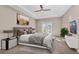 Main bedroom with a king-size bed, balcony access, and modern decor at 8273 Shooting Star Rd, Sarasota, FL 34241
