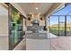 Outdoor kitchen with granite countertops and stainless steel appliances at 8273 Shooting Star Rd, Sarasota, FL 34241