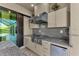 Stainless steel appliances and granite countertops highlight this outdoor kitchen at 8273 Shooting Star Rd, Sarasota, FL 34241