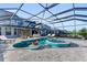 Relaxing pool and spa with covered patio and lounge chairs at 8273 Shooting Star Rd, Sarasota, FL 34241