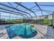 Resort-style pool and spa with covered patio and lounge area at 8273 Shooting Star Rd, Sarasota, FL 34241