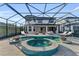 Relax in your own backyard oasis! This home boasts a stunning pool and spa with a covered lanai at 8273 Shooting Star Rd, Sarasota, FL 34241
