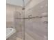Spa-like shower with glass enclosure and modern tile work at 8273 Shooting Star Rd, Sarasota, FL 34241