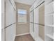 Spacious walk-in closet with ample shelving and hanging space at 8273 Shooting Star Rd, Sarasota, FL 34241