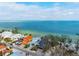 Beautiful beach home with ocean views, lush landscape, and private beach access at 915 N Shore Dr, Anna Maria, FL 34216