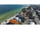 Beachfront home with mature tropical trees, steps to sandy beach, and ample parking at 915 N Shore Dr, Anna Maria, FL 34216