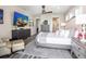 Spacious main bedroom with wood-style flooring, ensuite bathroom, and walk-in closets at 915 N Shore Dr, Anna Maria, FL 34216