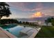Relaxing pool and spa area with stunning ocean views and comfortable lounge seating at 915 N Shore Dr, Anna Maria, FL 34216