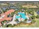 Aerial view showing resort-style pool and clubhouse at 10031 Crooked Creek Dr # 201, Venice, FL 34293