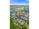 Aerial view of community amenities including tennis courts at 10031 Crooked Creek Dr # 201, Venice, FL 34293