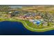 Aerial view of community with pool and clubhouse at 10031 Crooked Creek Dr # 201, Venice, FL 34293