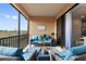 Spacious balcony with blue couches and a tranquil atmosphere at 10031 Crooked Creek Dr # 201, Venice, FL 34293