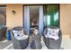 Cozy balcony with wicker chairs, offering a peaceful retreat at 10031 Crooked Creek Dr # 201, Venice, FL 34293