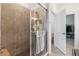 Bathroom with a large walk-in shower and tile surround at 10031 Crooked Creek Dr # 201, Venice, FL 34293