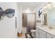 Clean bathroom, bathtub, shower, and white vanity at 10031 Crooked Creek Dr # 201, Venice, FL 34293