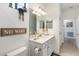 Bathroom with a vanity, toilet, and decorative accents at 10031 Crooked Creek Dr # 201, Venice, FL 34293
