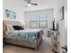 Bright bedroom with a comfortable bed, nightstands, and TV at 10031 Crooked Creek Dr # 201, Venice, FL 34293