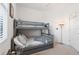 Bedroom with a full-over-full bunk bed and ample floor space at 10031 Crooked Creek Dr # 201, Venice, FL 34293
