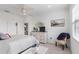 Bedroom with a bed, dresser, TV, and chair at 10031 Crooked Creek Dr # 201, Venice, FL 34293