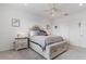 Bedroom with a bed, dresser, and window with blinds at 10031 Crooked Creek Dr # 201, Venice, FL 34293