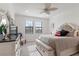 Bedroom with a comfy bed, dresser, and ceiling fan at 10031 Crooked Creek Dr # 201, Venice, FL 34293