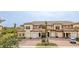 Attractive three-story townhome with two-car garage and manicured landscaping at 10031 Crooked Creek Dr # 201, Venice, FL 34293