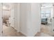 Clean hallway with doors to bathroom and bedroom at 10031 Crooked Creek Dr # 201, Venice, FL 34293