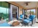Spacious lanai with outdoor seating and access to living area at 10031 Crooked Creek Dr # 201, Venice, FL 34293