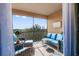 Screened lanai with wicker furniture and tranquil views at 10031 Crooked Creek Dr # 201, Venice, FL 34293