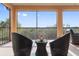 Relaxing screened balcony with wicker furniture and lovely views at 10031 Crooked Creek Dr # 201, Venice, FL 34293