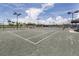 Newly resurfaced tennis courts with ample seating at 10031 Crooked Creek Dr # 201, Venice, FL 34293