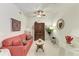 Cozy den featuring a red sofa and a dark wood cabinet at 1105 Gondola Park Dr # 1105, Venice, FL 34292