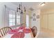 Cozy dining area with wooden table and red placemats at 1105 Gondola Park Dr # 1105, Venice, FL 34292