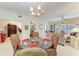 Elegant dining room with glass table and floral chairs at 1105 Gondola Park Dr # 1105, Venice, FL 34292