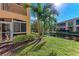 Condo exterior with canal view and lush landscaping at 1105 Gondola Park Dr # 1105, Venice, FL 34292