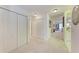 Bright hallway with white doors and carpet flooring at 1105 Gondola Park Dr # 1105, Venice, FL 34292