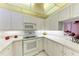 White kitchen with appliances and ample counter space at 1105 Gondola Park Dr # 1105, Venice, FL 34292